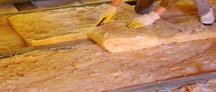 Construction Worker Thermally Insulating House — H&D Building Supplies in Heatherbrae, NSW