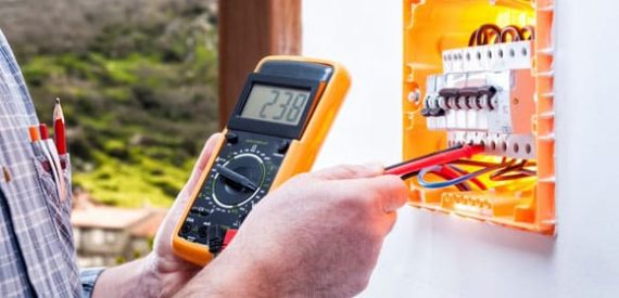 Electrician At Work — H&D Building Supplies in Port Stephens, NSW Electrician At Work — H&D Building Supplies in Port Stephens, NSW