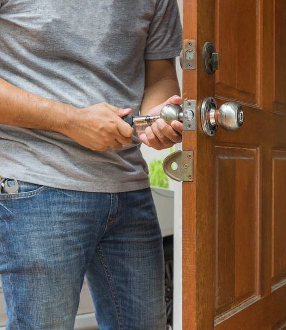 Locksmith Repairing Door Knob — H&D Building Supplies in Heatherbrae, NSW