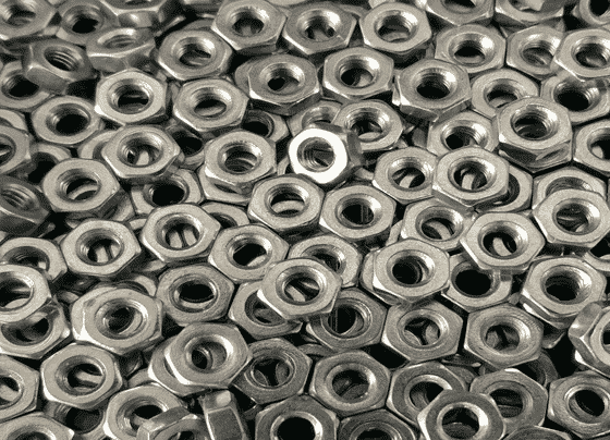 Pile Of Silver Hex Nuts — H&D Building Supplies in Heatherbrae, NSW Pile Of Silver Hex Nuts — H&D Building Supplies in Heatherbrae, NSW