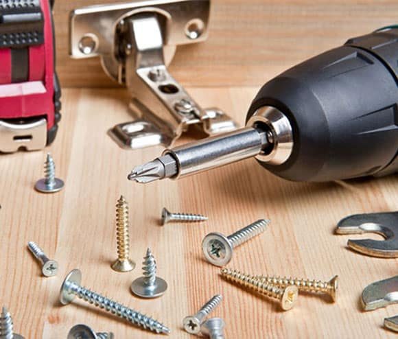 Power Tools and Screwdriver on Table — H&D Building Supplies in Heatherbrae, NSW